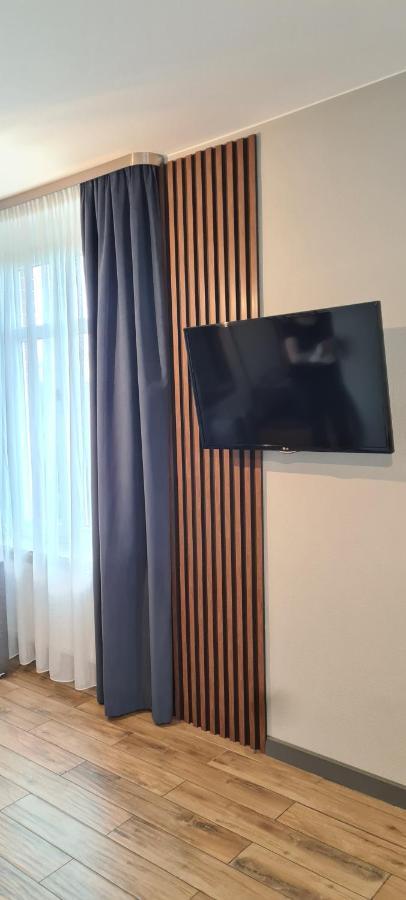 Apartsuites I Sorau Żary Buitenkant foto A wall-mounted television